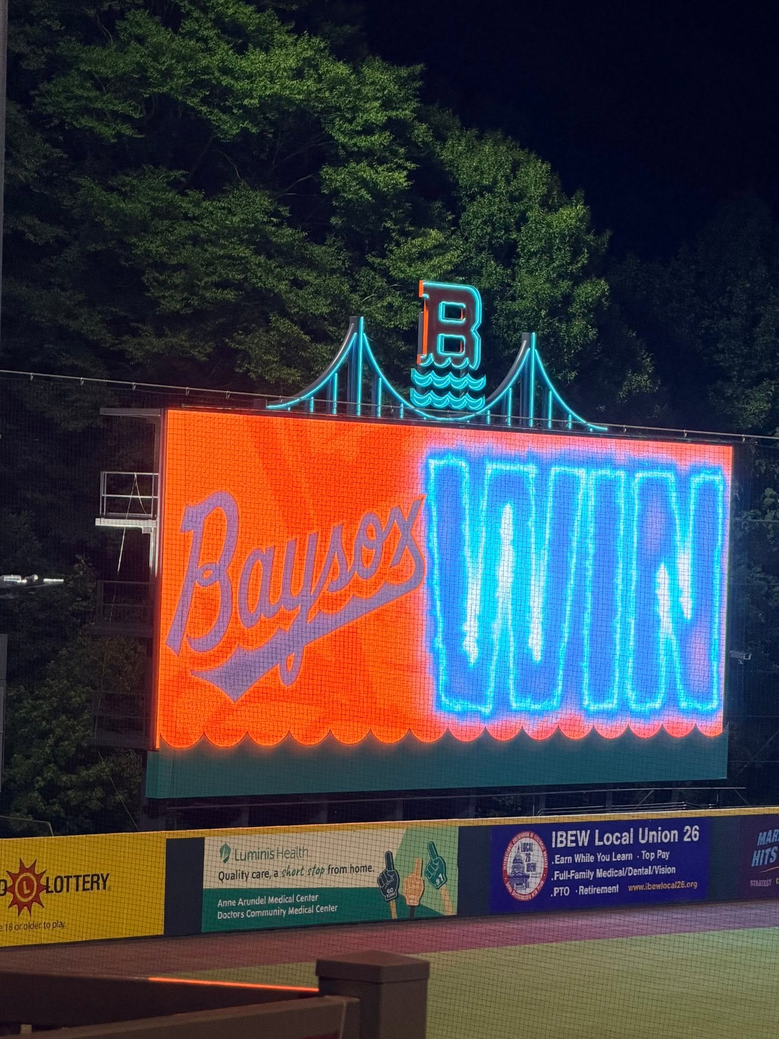 Baysox stadium scoreboard sign lit up at night